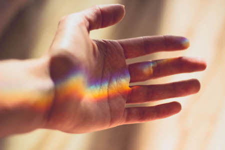 Healing touch, hand with light spectrum